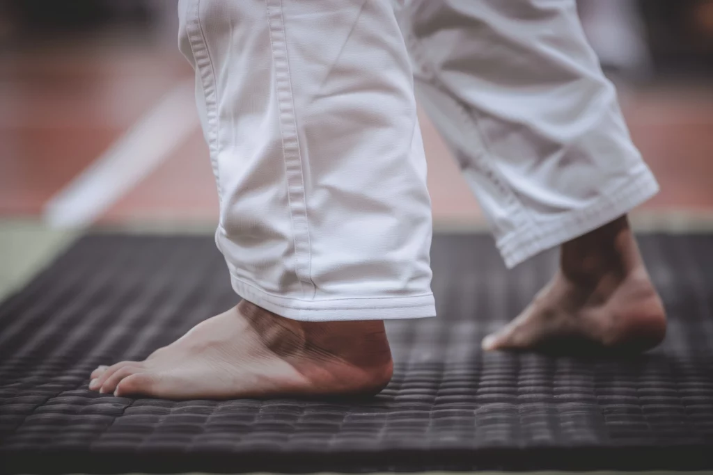 person exercising on tatami