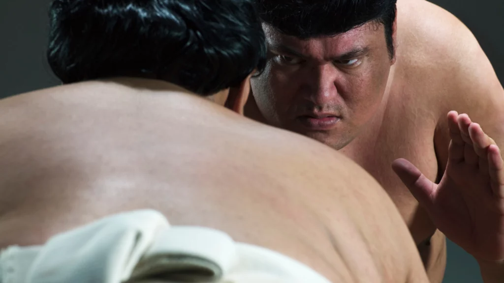 two sumo wrestlers face to face